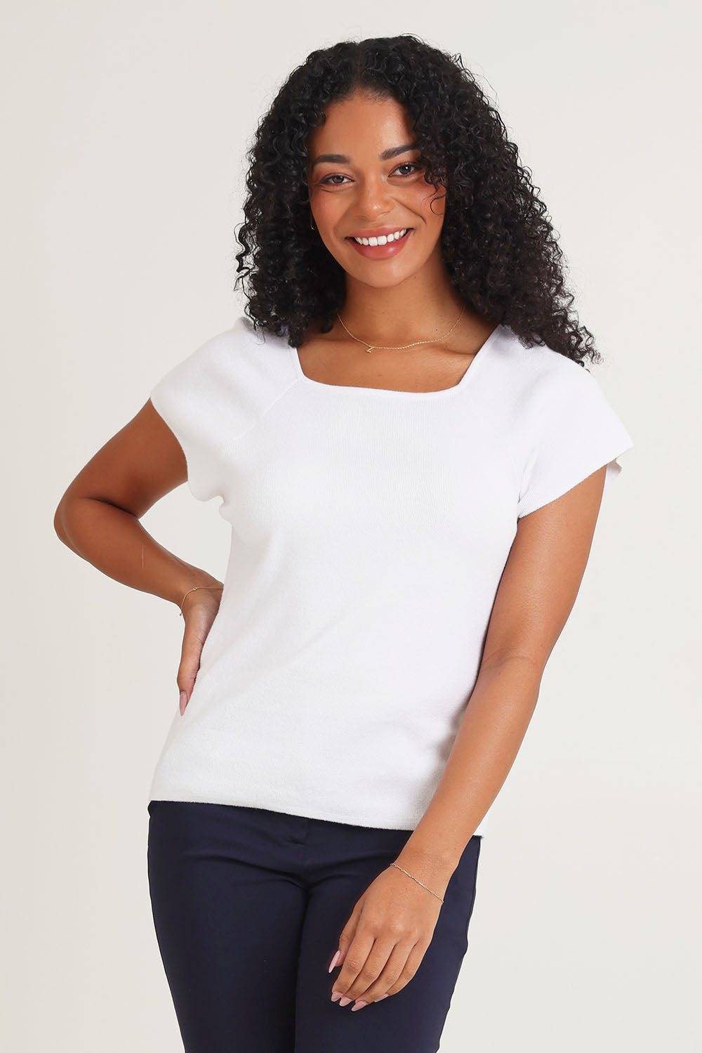 Model Ziara wearing size 10 of the Essentials Squareneck Knit Cotton Top in colour White (White), from the front, cropped image
