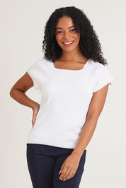 Model Ziara wearing size 10 of the Essentials Squareneck Knit Cotton Top in colour White (White), from the front, cropped image