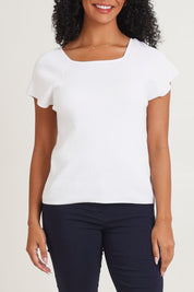 Model Ziara wearing size 10 of the Essentials Squareneck Knit Cotton Top in colour White (White), from the front, cropped image