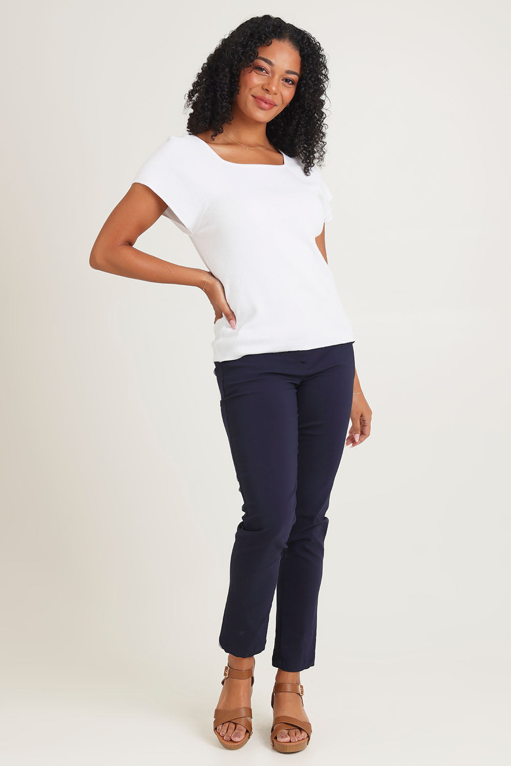 Model Ziara wearing size 10 of the Essentials Squareneck Knit Cotton Top in colour White (White), from the front, showing the whole outfit
