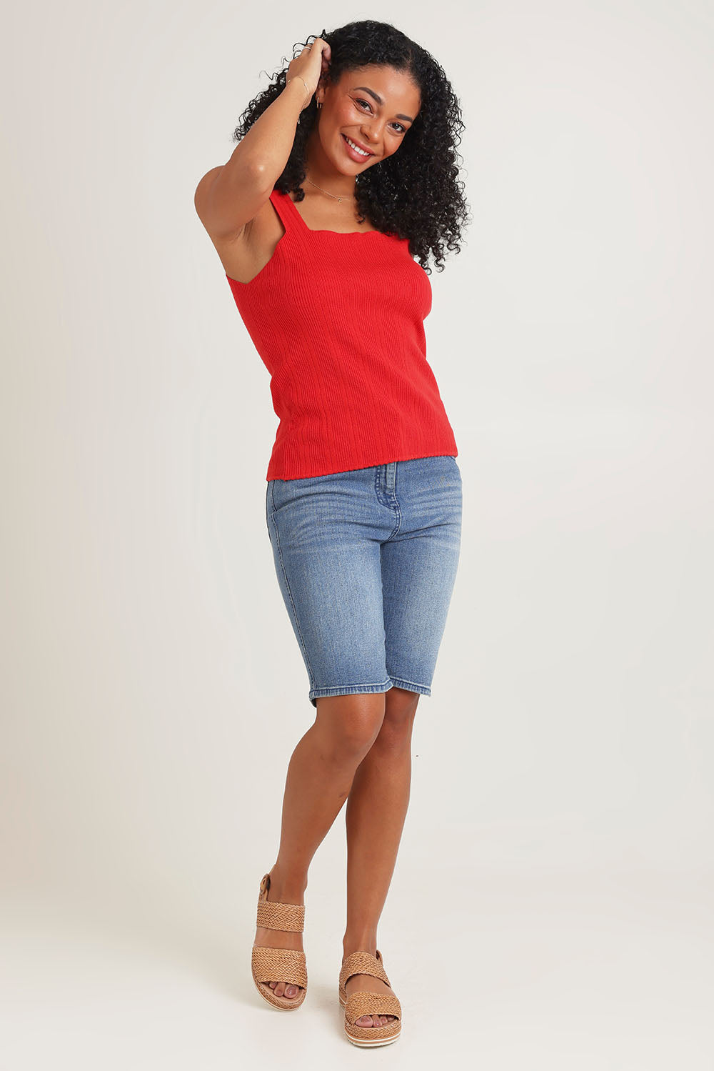 Model Ziara wearing size 10 of the Essentials Squareneck Knit Cotton Tank in colour Red (Red), from the front, showing the whole outfit