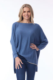 A model wearing the Knit Oversize Top in colour Denim (Blue), from the front, cropped image