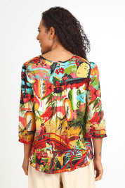 Model Pamelar wearing size 10 of the Pleated Top – Print in colour Print, from the back