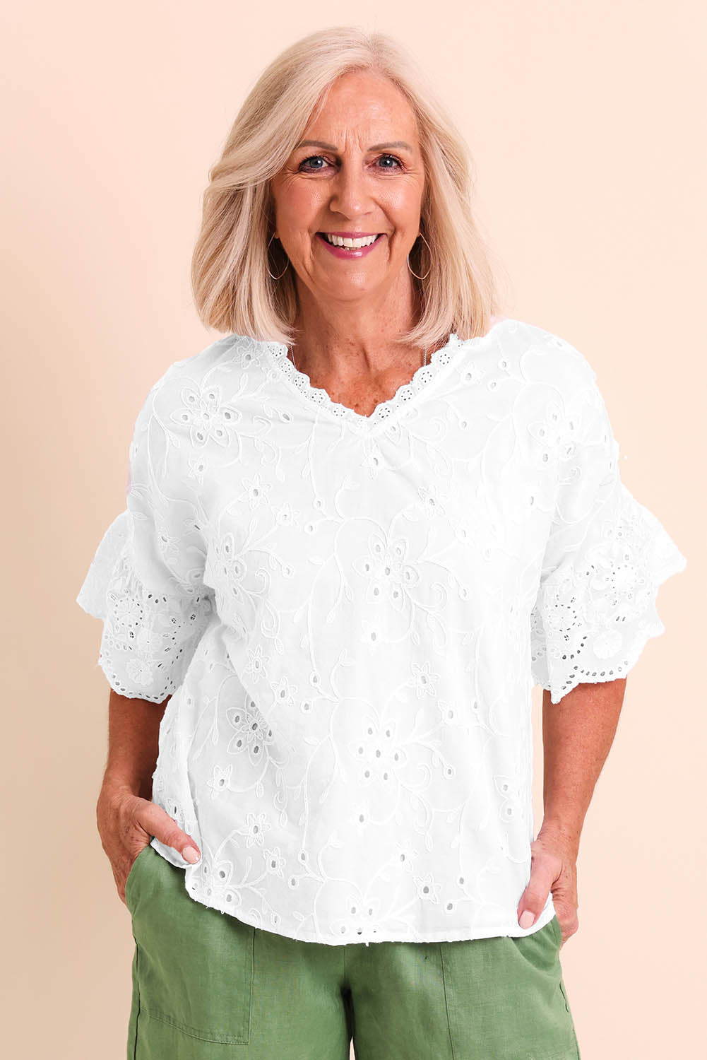 Model Sandys wearing size 10 of the Essentials Broderie Frill Sleeve Cotton Top - White in colour White, in a cropped view