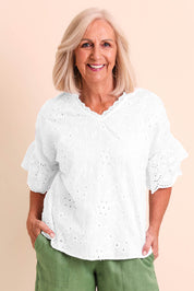 Model Sandys wearing size 10 of the Essentials Broderie Frill Sleeve Cotton Top - White in colour White, in a cropped view