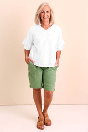 Model Sandys wearing size 10 of the Essentials Broderie Frill Sleeve Cotton Top - White in colour White, from the front