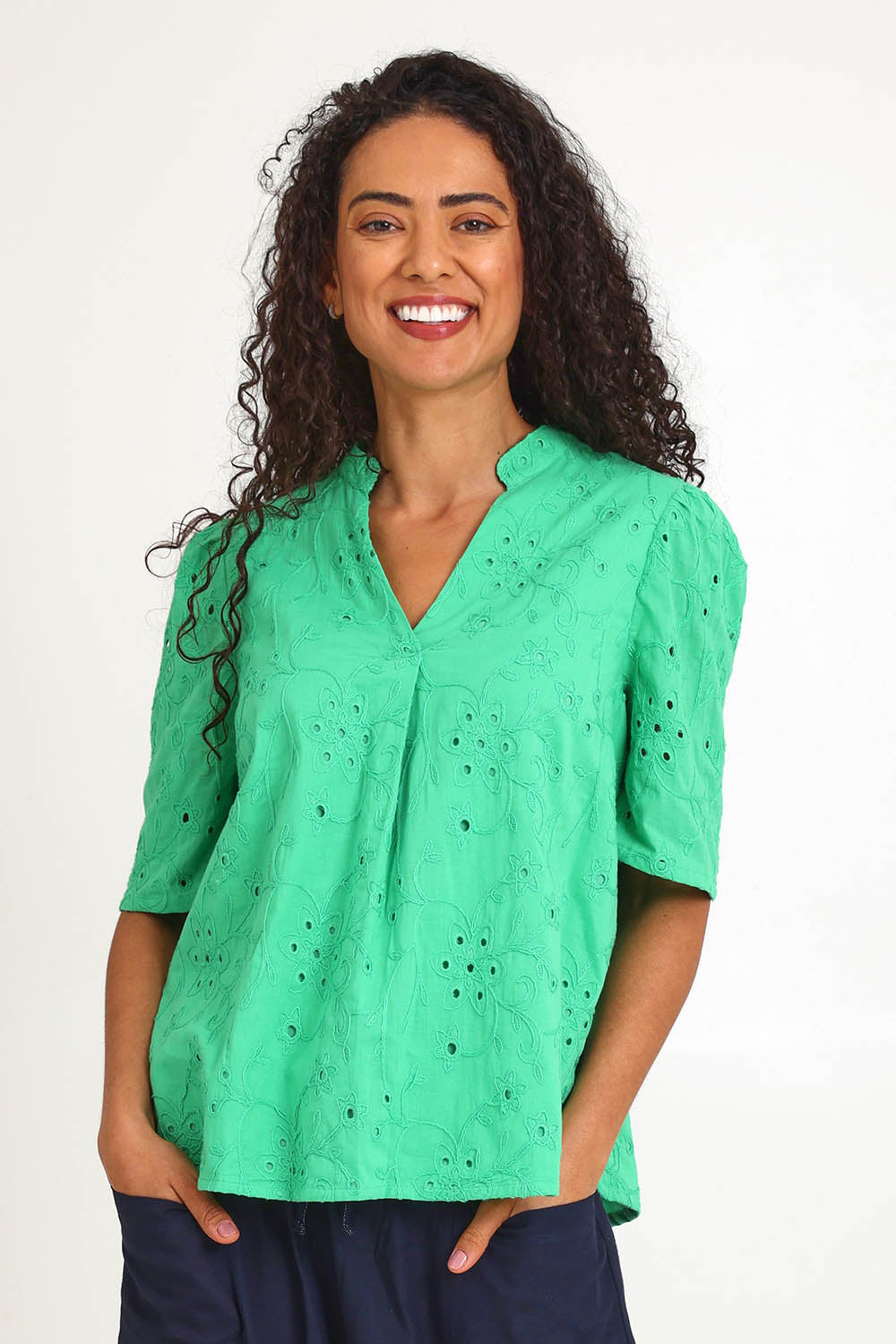 Model Pamelar wearing size 10 of the Essentials Broderie Cotton Top - Green in colour Green, in a cropped view