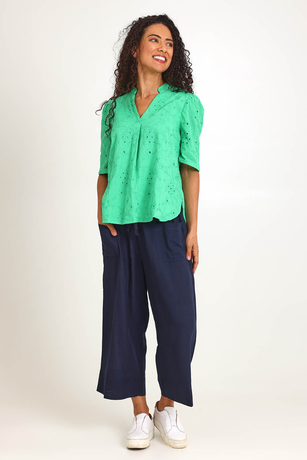 Model Pamelar wearing size 10 of the Essentials Broderie Cotton Top - Green in colour Green, from the front