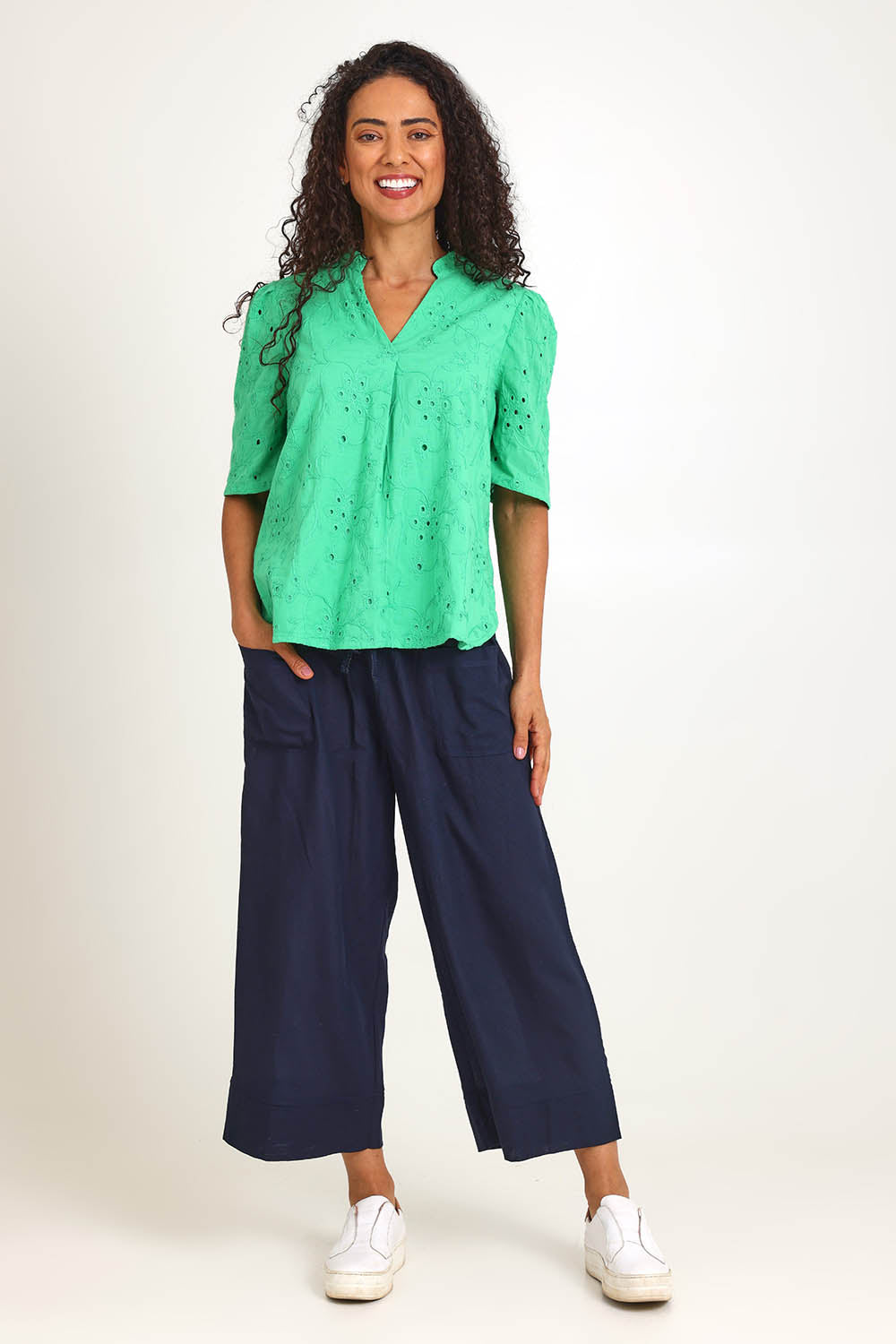 Model Pamelar wearing size 10 of the Essentials Broderie Cotton Top - Green in colour Green, from the front
