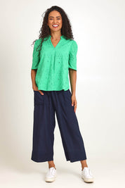 Model Pamelar wearing size 10 of the Essentials Broderie Cotton Top - Green in colour Green, from the front