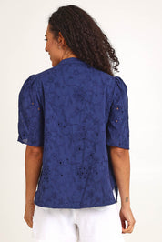 Model Pamelar wearing size 10 of the Essentials Broderie Cotton Top - Navy in colour Navy, from the back