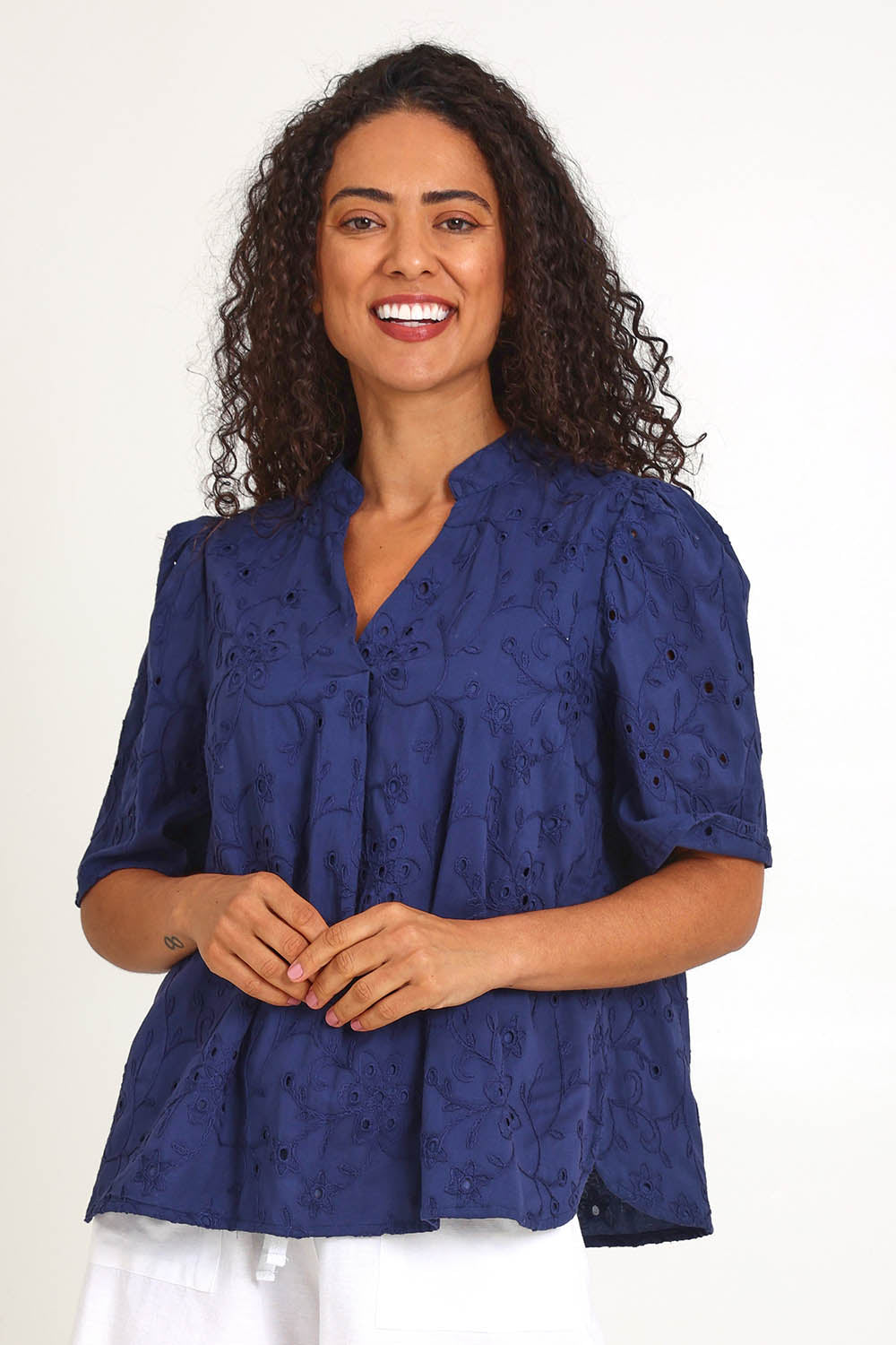 Model Pamelar wearing size 10 of the Essentials Broderie Cotton Top - Navy in colour Navy, in a cropped view