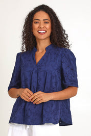 Model Pamelar wearing size 10 of the Essentials Broderie Cotton Top - Navy in colour Navy, in a cropped view