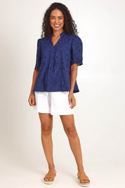 Model Pamelar wearing size 10 of the Essentials Broderie Cotton Top - Navy in colour Navy, from the front