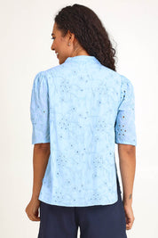 Model Pamelar wearing size 10 of the Essentials Broderie Cotton Top - Sky in colour Sky, from an angle