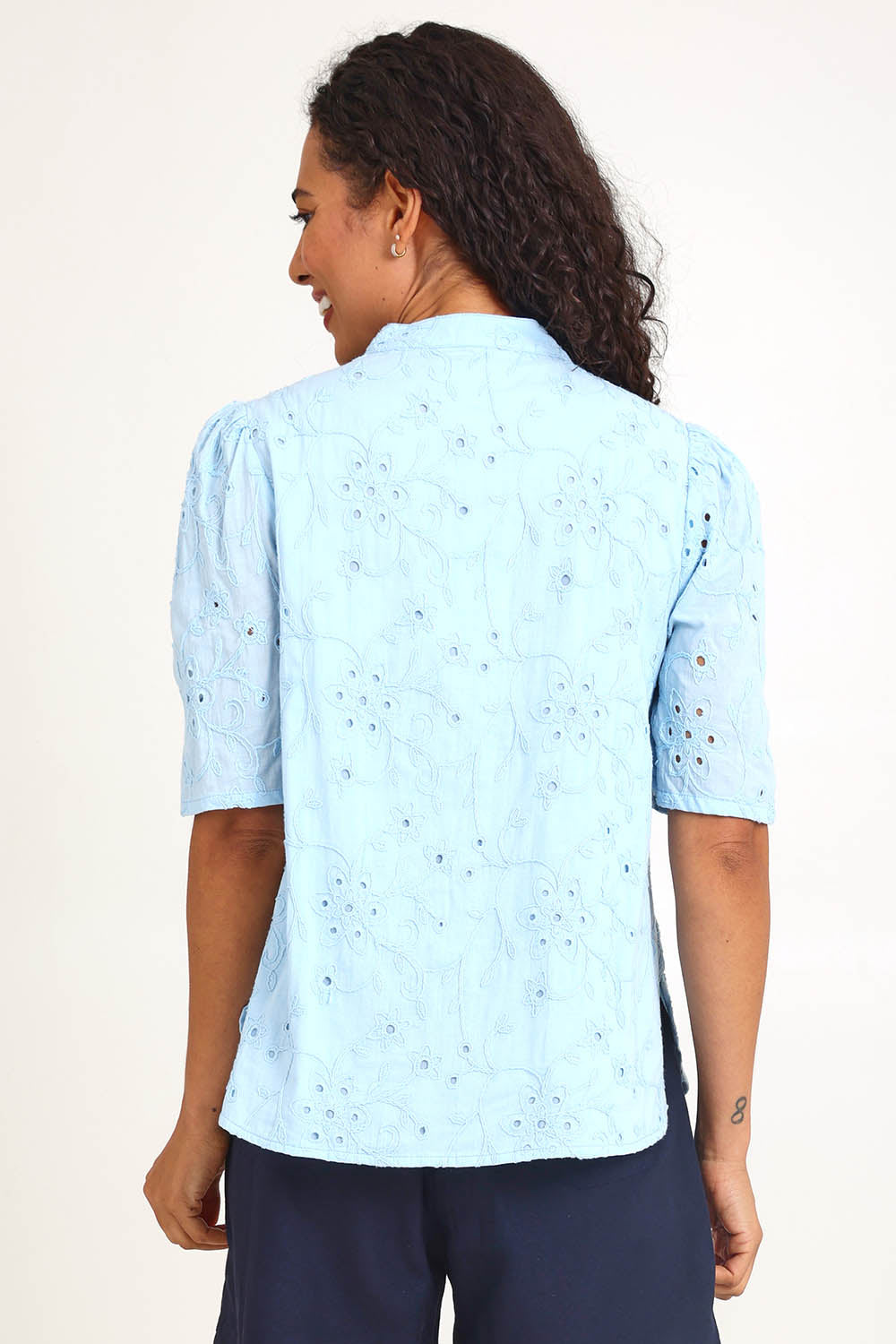 Model Pamelar wearing size 10 of the Essentials Broderie Cotton Top - Sky in colour Sky, from the back