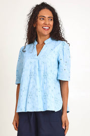 Model Pamelar wearing size 10 of the Essentials Broderie Cotton Top - Sky in colour Sky, in a cropped view