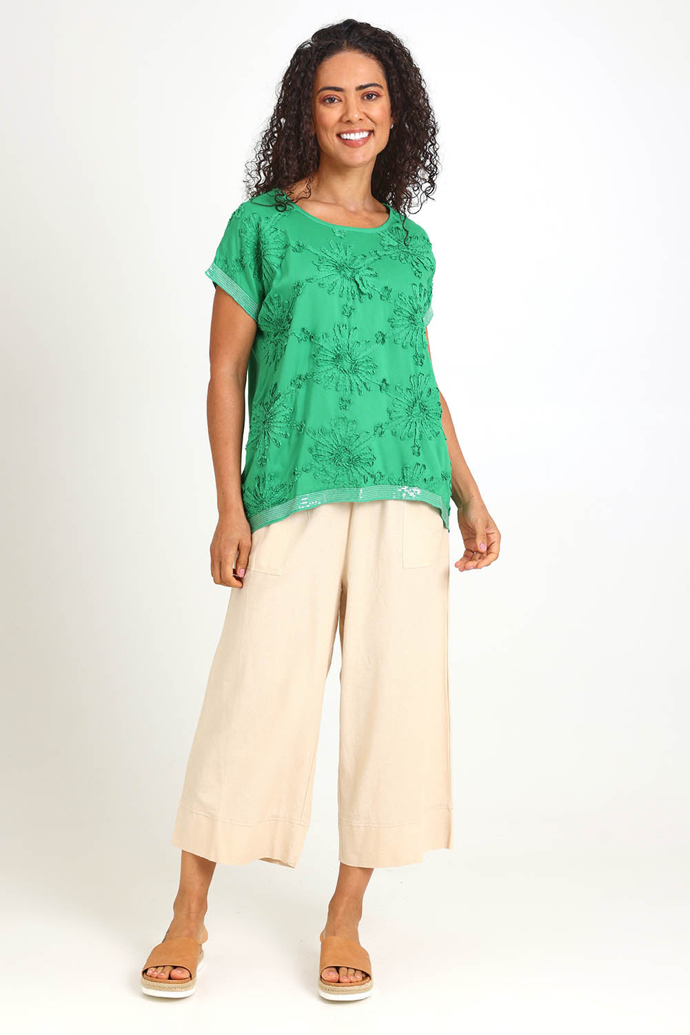 Model Pamelar wearing size 10 of the Embellished Tee – Green in colour Green, from the front