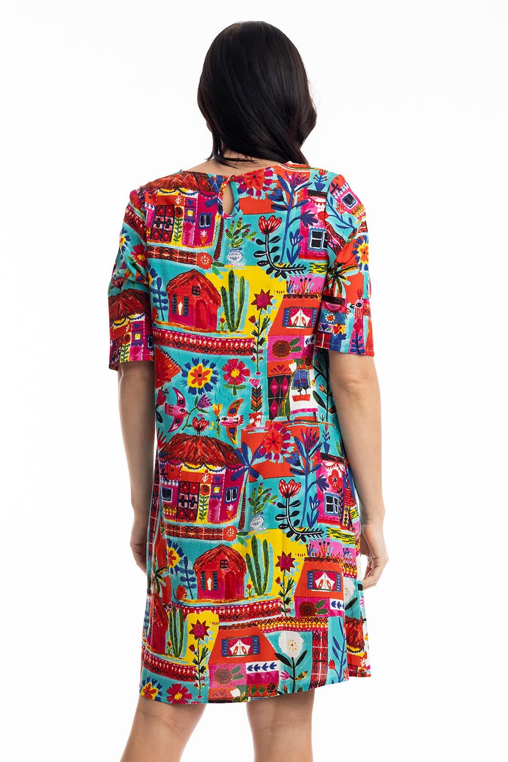 A model wearing the Contemporary Elbow Sleeve Dress in colour Folkhuts (Blue), from the back
