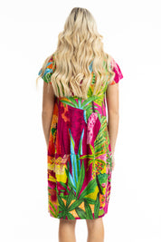 A model wearing the Printed Bubble Organic Cotton Dress in colour Marrakesh (Red), from the back