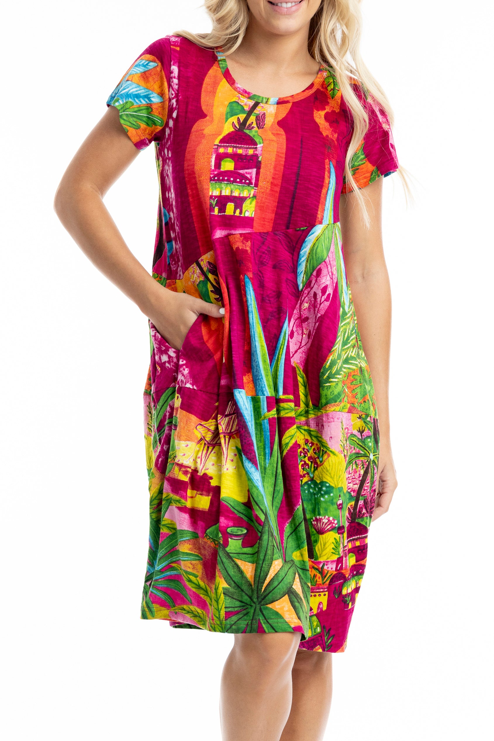 A model wearing the Printed Bubble Organic Cotton Dress in colour Marrakesh (Red), from the front, cropped image
