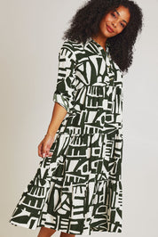 Model Ziara wearing size 10 of the Corduroy Cotton Collar Dress in colour Olive (Green), from the front, cropped image