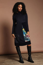 Model Ziara wearing size 10 of the New York Patch Cowl Cotton Dress in colour Newyork (Black), from the front, showing the whole outfit