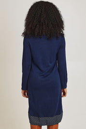 Model Ziara wearing size 10 of the Dancing Queen Cotton Patch Dress in colour Dancing (Blue), from the back