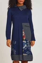 Model Ziara wearing size 10 of the Dancing Queen Cotton Patch Dress in colour Dancing (Blue), from the front, cropped image
