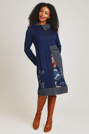 Model Ziara wearing size 10 of the Dancing Queen Cotton Patch Dress in colour Dancing (Blue), from the front, showing the whole outfit