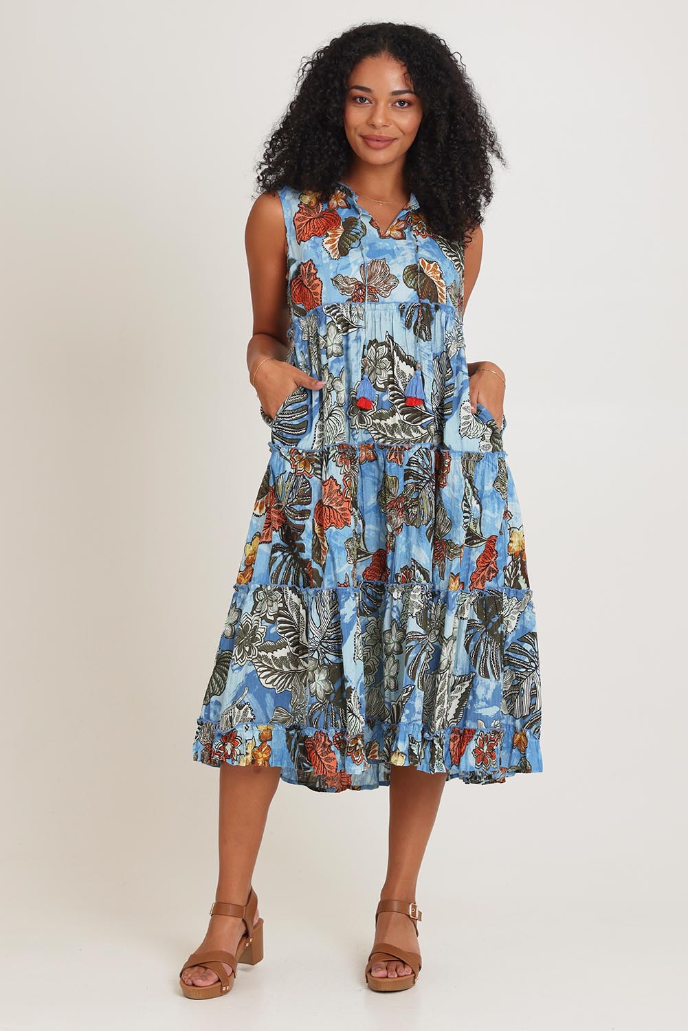Model Ziara wearing size 10 of the Cotton Sleeveless Layers Dress in colour Lima (Blue), from the front, showing the whole outfit
