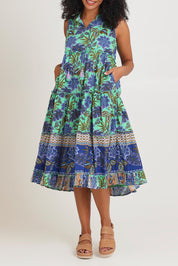 Model Ziara wearing size 10 of the Sleeveless Layers Cotton Dress in colour Lascuevas, from the front, cropped image