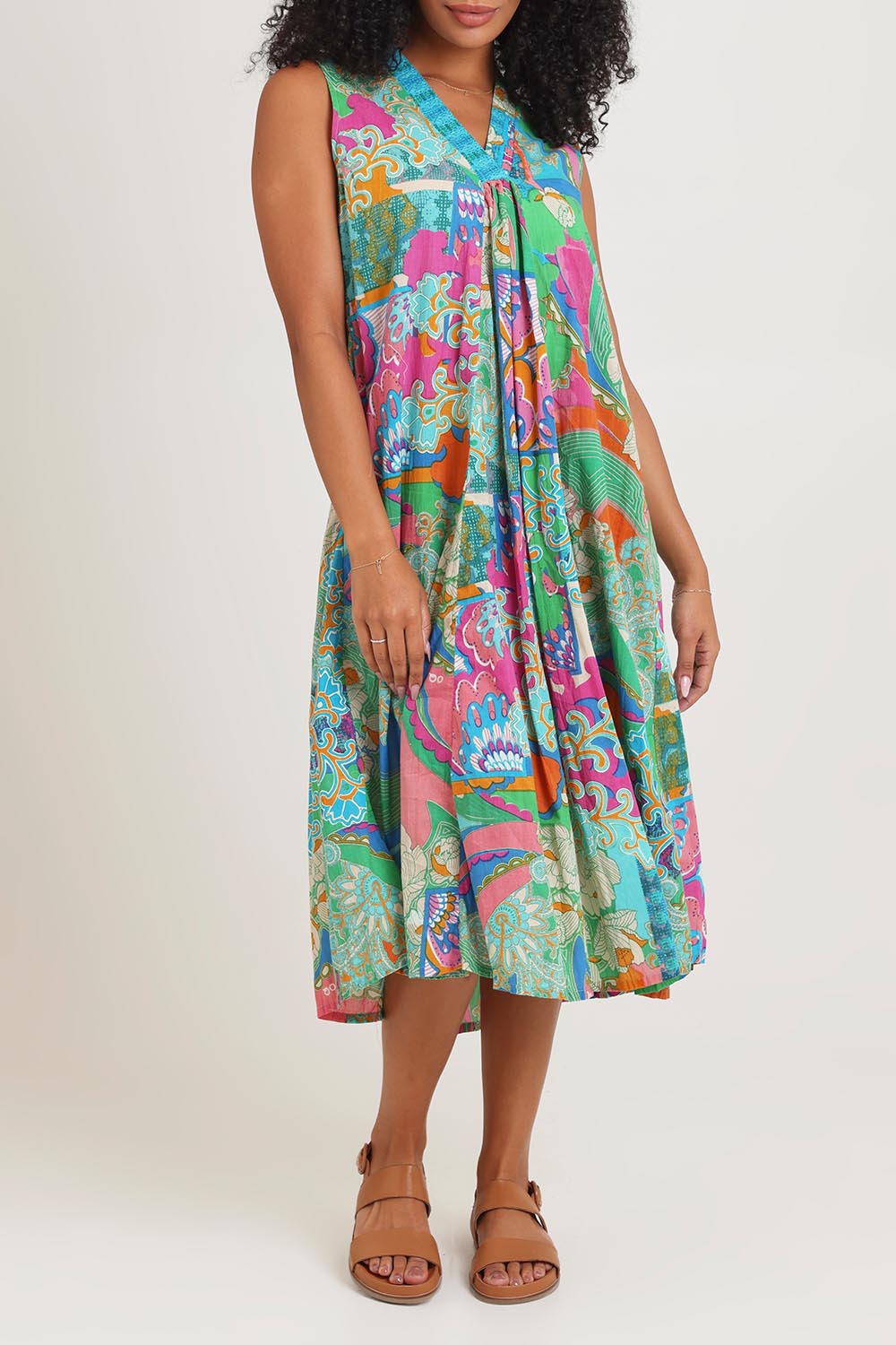 Model Ziara wearing size 10 of the Sleeveless V Cotton Dress in colour Santacruz, from the front, cropped image