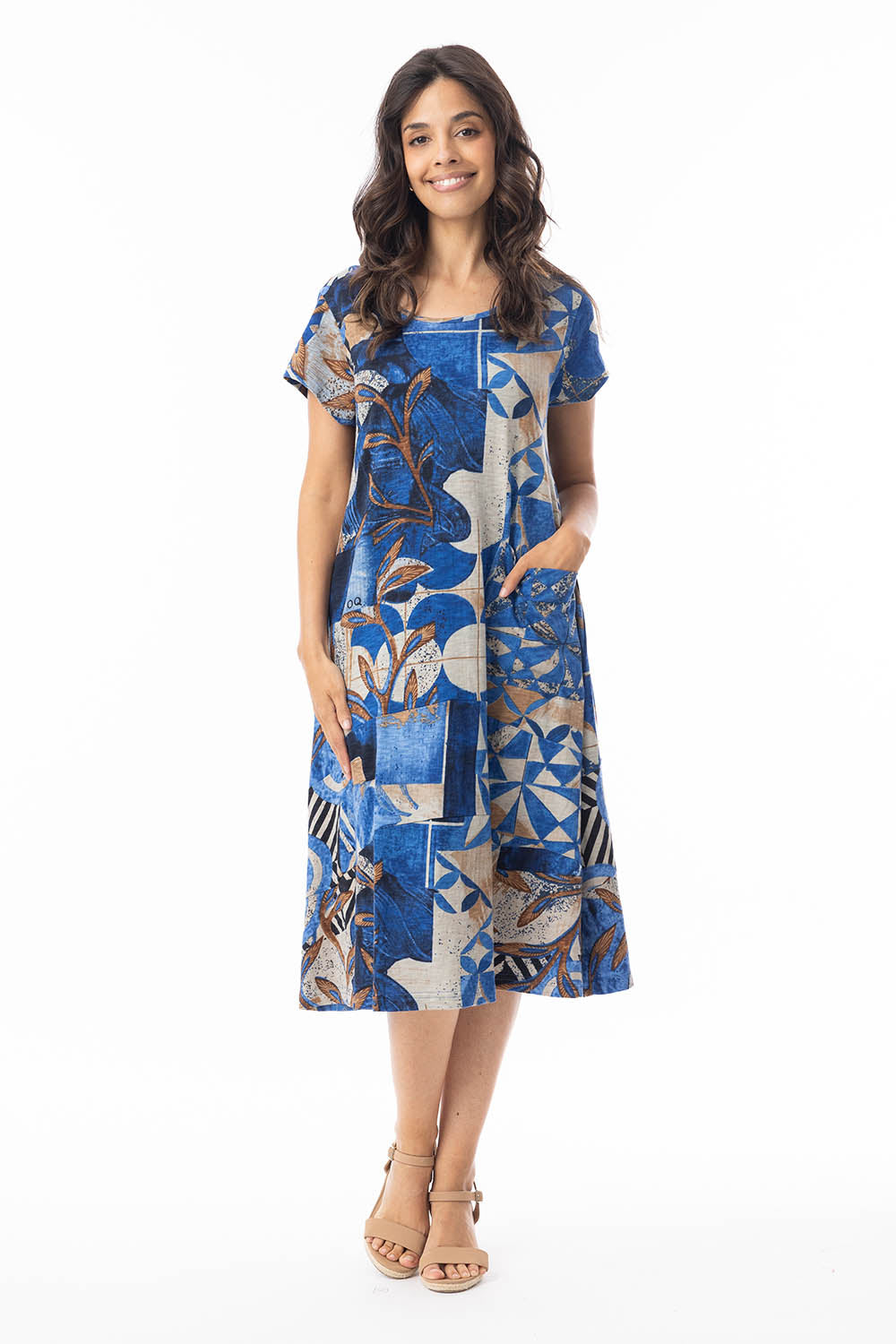 A model wearing the Wyndham Shift Flair Cotton Dress in colour Print, from the front, showing the whole outfit