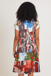 Model Ziara wearing size 10 of the Printed Cotton Crew Flair Shift Dress in colour Towerpeach, from the back