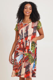 Model Ziara wearing size 10 of the Printed Cotton Crew Flair Shift Dress in colour Towerpeach, from the front, cropped image