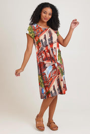 Model Ziara wearing size 10 of the Printed Cotton Crew Flair Shift Dress in colour Towerpeach, from the front, showing the whole outfit