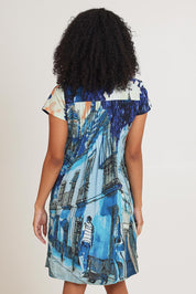 Model Ziara wearing size 10 of the Ezy Fit Cotton Dress in colour Towerblue, from the back