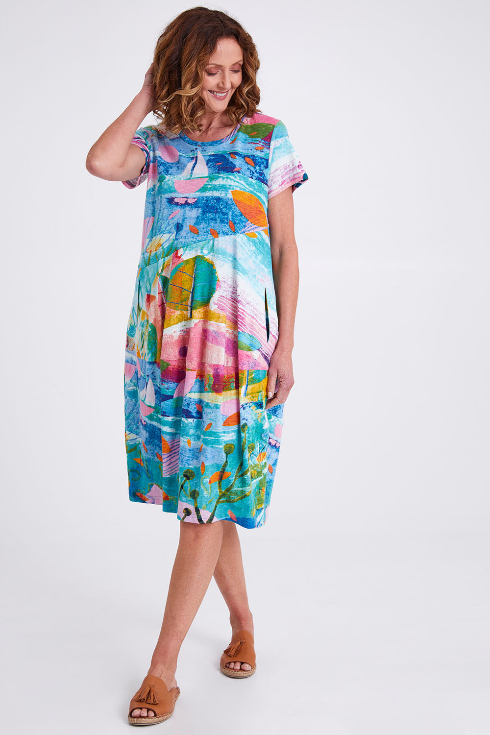 Model Emma wearing size 10 of the Printed Bubble Organic Cotton Dress in colour Dreamland (Blue), from the front, showing the whole outfit