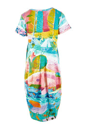 Product shot of the Printed Bubble Organic Cotton Dress in colour Dreamland (Blue), from the back