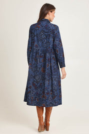 Model Madeline wearing size 10 of the Midi Collar Dress in colour Tabriz (Blue), from the back