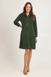 Model Madeline wearing size 10 of the Cord Solids Pockets Dress in colour Military (Green), from the front, showing the whole outfit