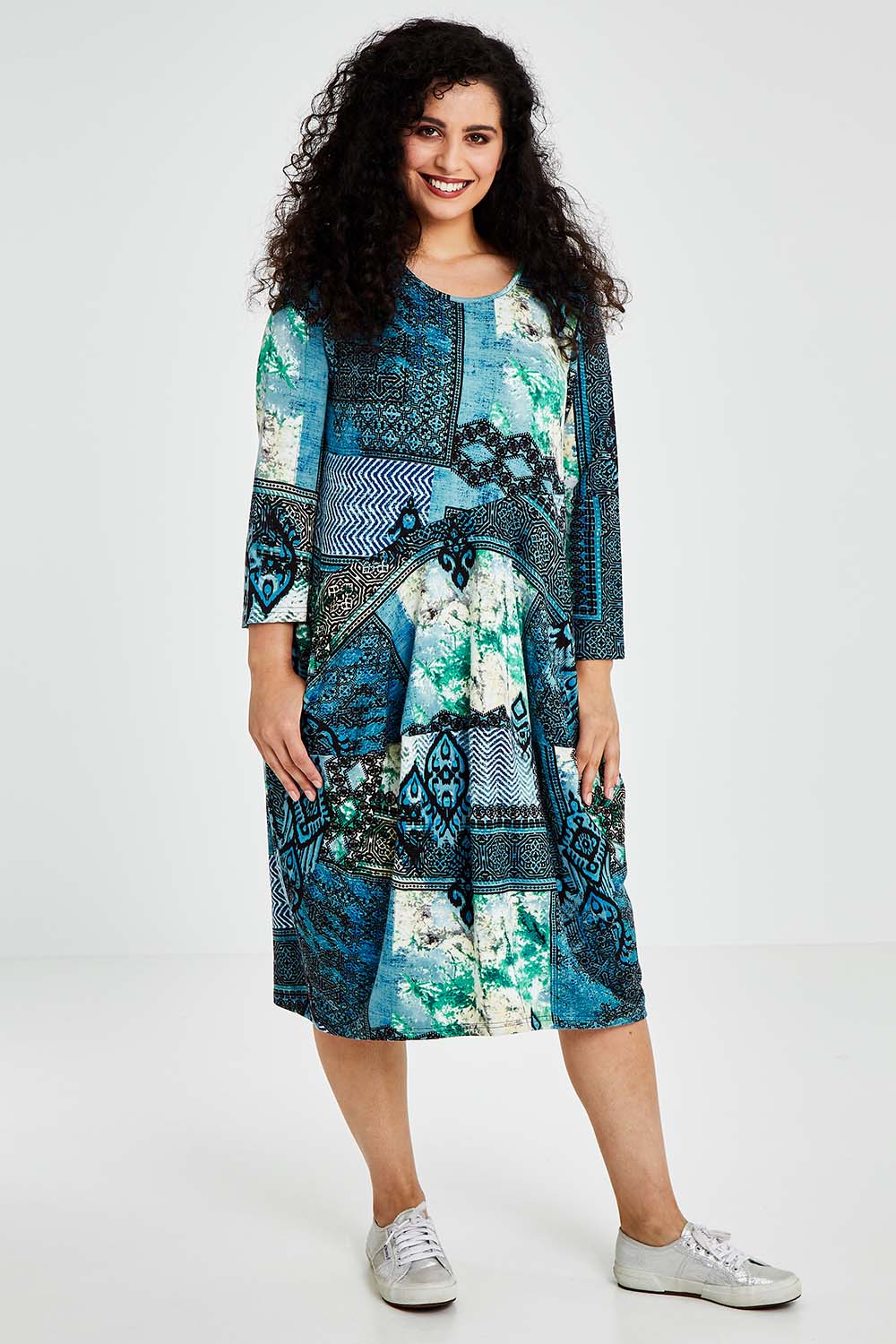 A model wearing size 10 of the Isfahani Dress Bubble in colour Blue (Blue), from the front, showing the whole outfit