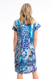 Model Genericm wearing size sample of the Easy Fit Dress – Print in colour Print, from the back