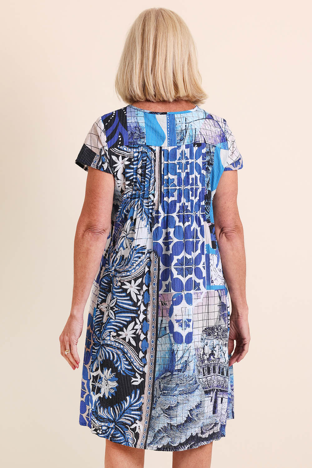Model Sandys wearing size 10 of the Easy Fit Cotton Dress – Print in colour Print, from the back