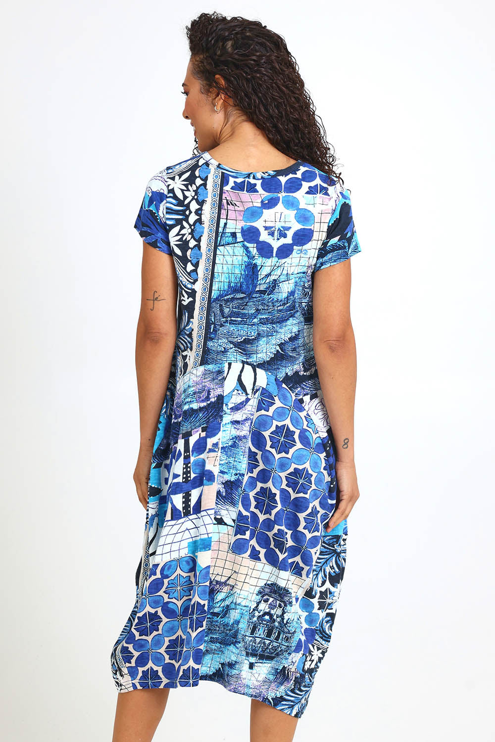 Model Pamelar wearing size 10 of the Horseshoe Bubble Dress – Print in colour Print, from the back