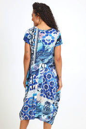 Model Pamelar wearing size 10 of the Horseshoe Bubble Dress – Print in colour Print, from the back