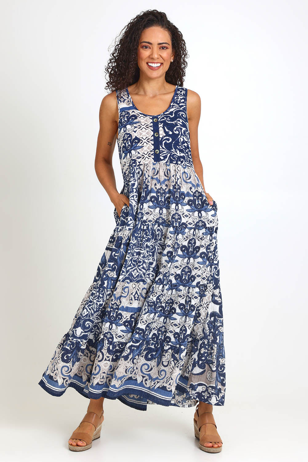 Model Pamelar wearing size 10 of the Sleeveless Knit Top Dress – Print in colour Print, from the front