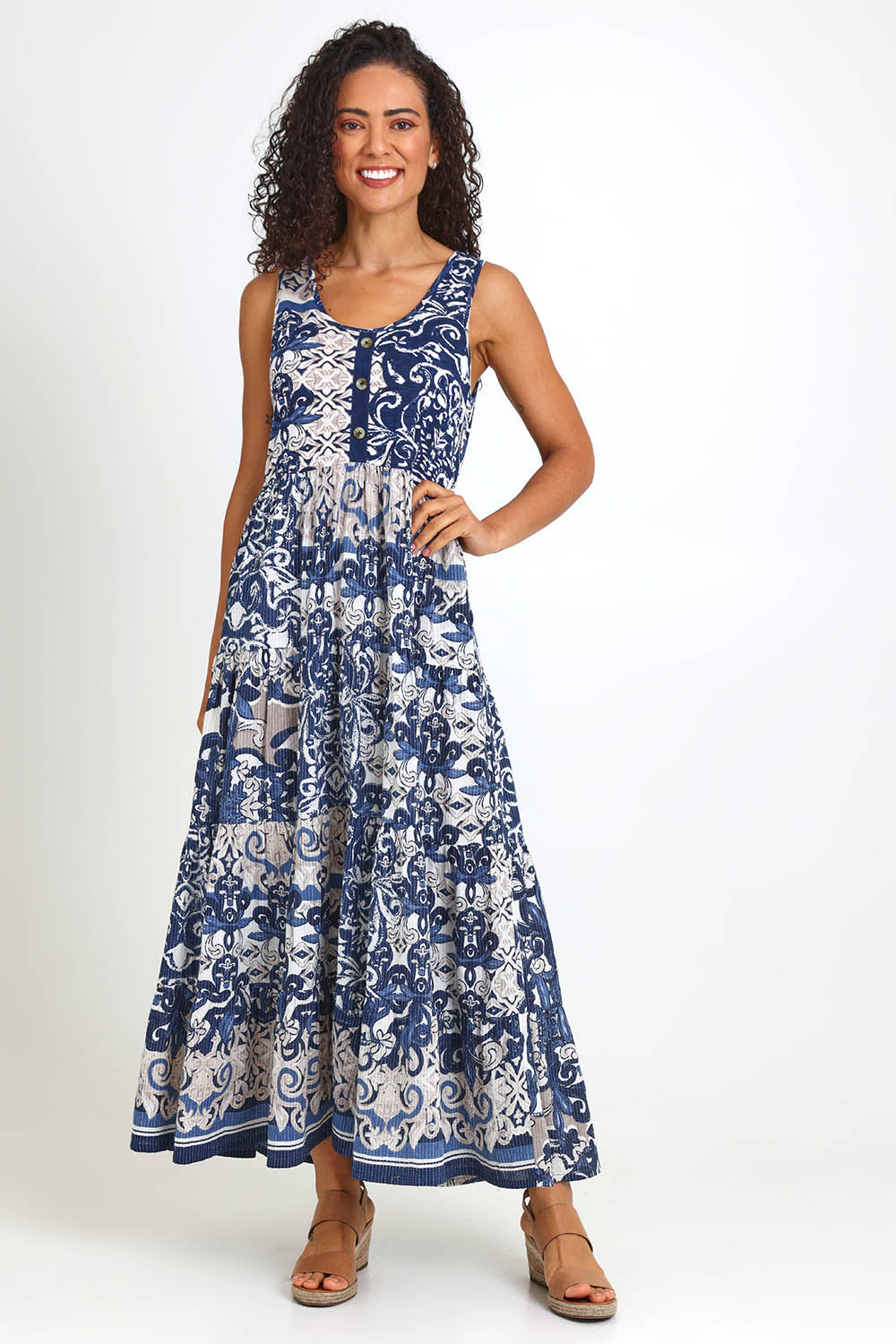 Model Pamelar wearing size 10 of the Sleeveless Knit Top Dress – Print in colour Print, from the front