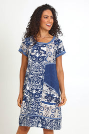 Model Pamelar wearing size 10 of the Patch Dress – Print in colour Print, in a cropped view